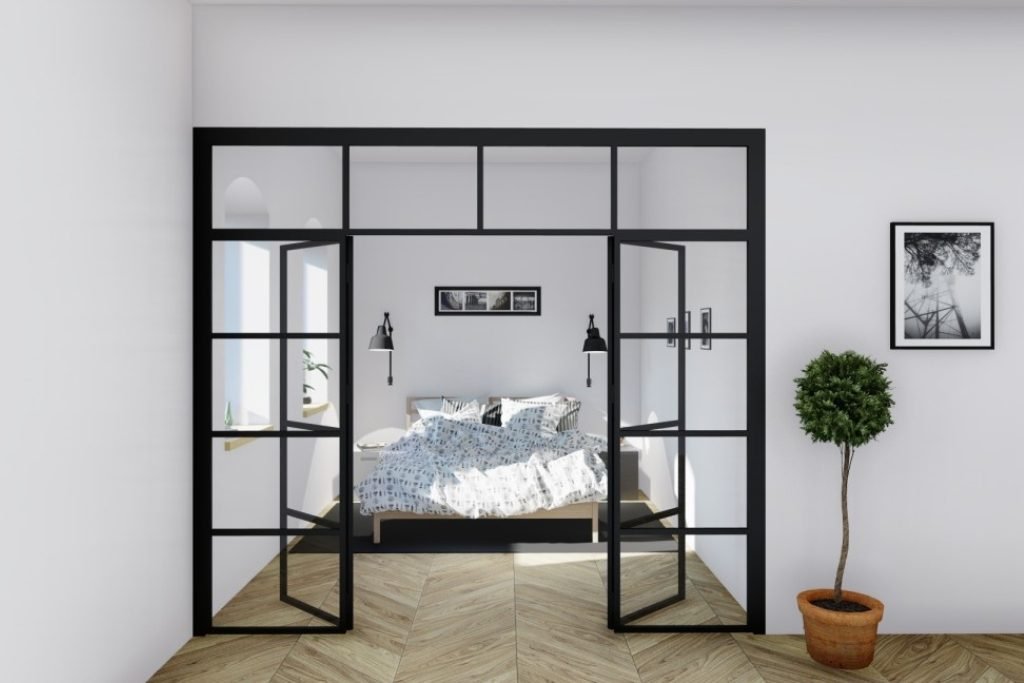Foldedør med glass i svart aluminium – stilfull og industriell design for moderne rom.